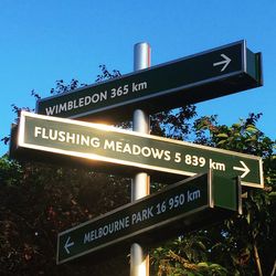 Information sign against clear blue sky