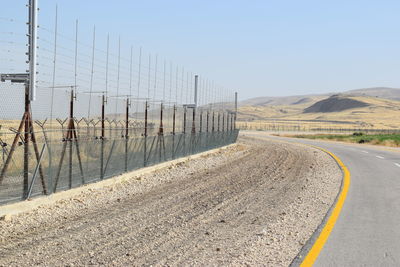 Israel border next jordan and a road against clear sky