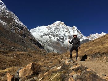 Rear view of man walking on mountain