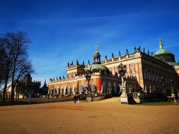 Facade of historical building against blue sky