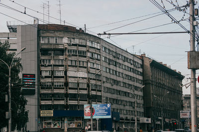 Low angle view of buildings against sky in city