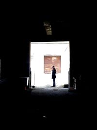 Full length of woman standing on wall