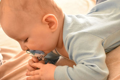 Close-up of boy holding baby girl