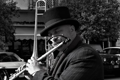 Man playing flute on street