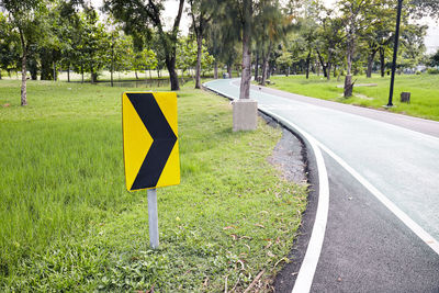 Road sign on field