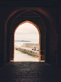 Scenic view of sea against sky seen through window