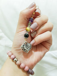 Close-up of woman holding bracelet