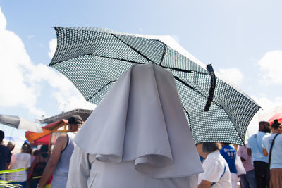  people are seen using umbrellas in the center of the city of salvador, bahia.