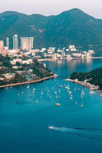View of boats middle islands buildings in seaside at deep water bay hong kong seen form brick hill 