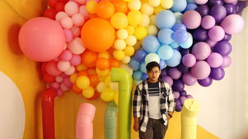 Portrait of man with balloons