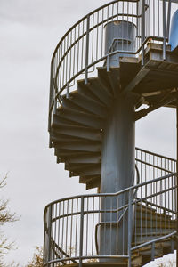 Low angle view of spiral staircase against sky