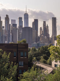 Modern buildings against sky in city