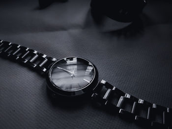 Close-up of wristwatch on table