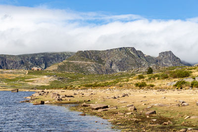 Scenic view of rocks on land against sky