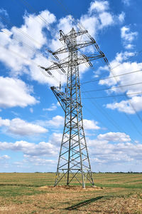 An electricity pylon with medium voltage power lines seen in germany