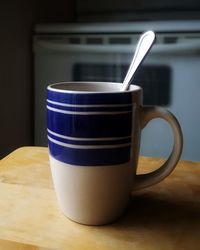 Close-up of coffee cup on table