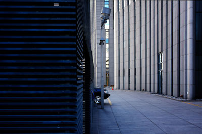 Empty street amidst buildings in city