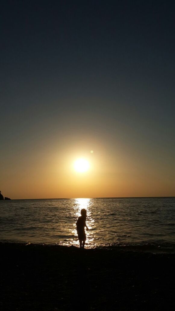 sunset, sea, horizon over water, water, sun, silhouette, beach, scenics, tranquil scene, beauty in nature, orange color, shore, tranquility, idyllic, reflection, nature, sky, standing