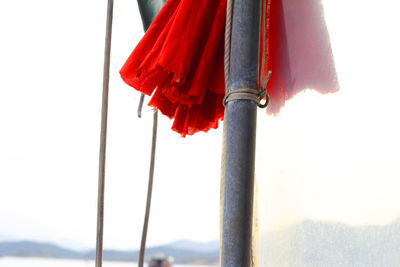 Low angle view of poles against sky