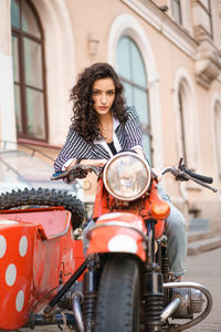 Young woman riding horse