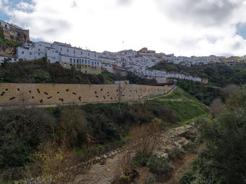 Scenic view of residential district against sky