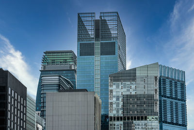 Low angle view of modern buildings against sky