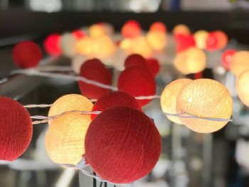 Close-up of lanterns hanging on wood