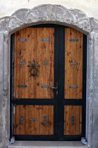 Closed wooden door of old building