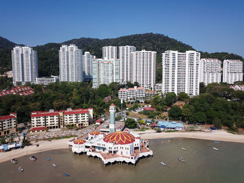 Aerial view floating mosque and the development construction at tanjung bungah.