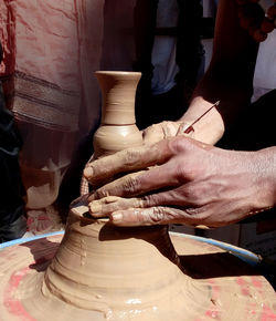 Potter making pottery on a spinning wheel...