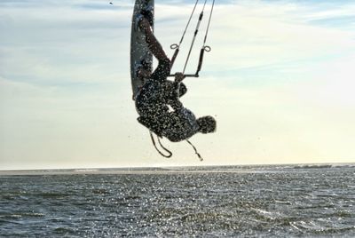 People surfing in sea