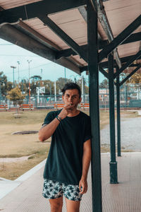 Portrait of man smoking outdoors