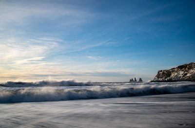 Scenic view of sea against sky during winter