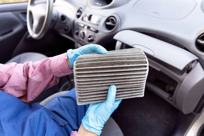 Close-up of hand holding car