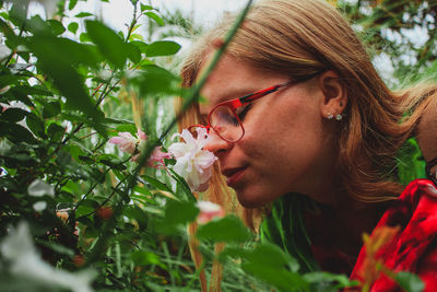 Woman smelling flowers