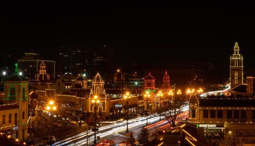 High angle view of city lit up at night