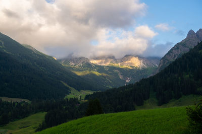 Scenic view of landscape and mountains against sky