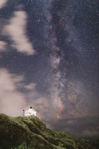 Low angle view of birds on mountain at night