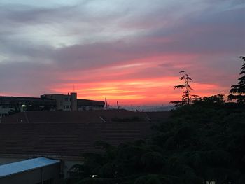 Buildings against sky during sunset