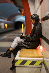 Side view of woman sitting in bus