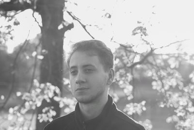 Portrait of young man against plants