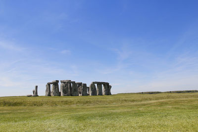 Built structure on field against sky