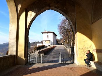 Man walking by building in city