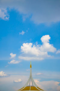 High section of building against blue sky