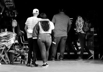 Rear view of people walking in corridor