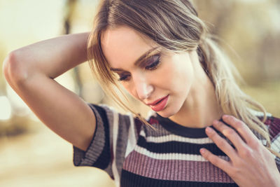 Close-up portrait of woman at park