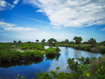 Scenic view of lake against blue sky