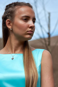 Young girl on a background of a dark mountain