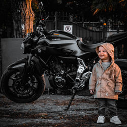 Full length portrait of woman standing in city