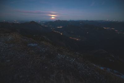 Scenic view of mountains against sky at night